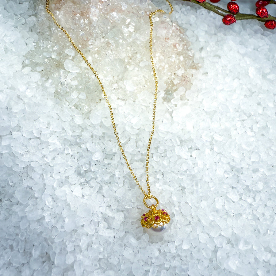 White Freshwater Pearl Necklace with Floral beadcap accented with pink CZ stones.