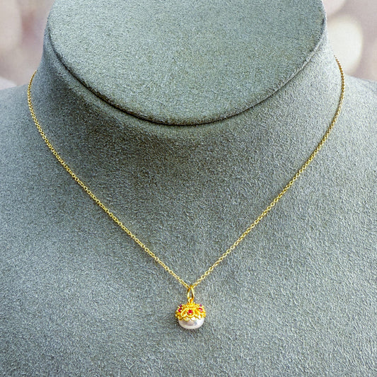 White Freshwater Pearl Necklace with Floral beadcap accented with pink CZ stones. 