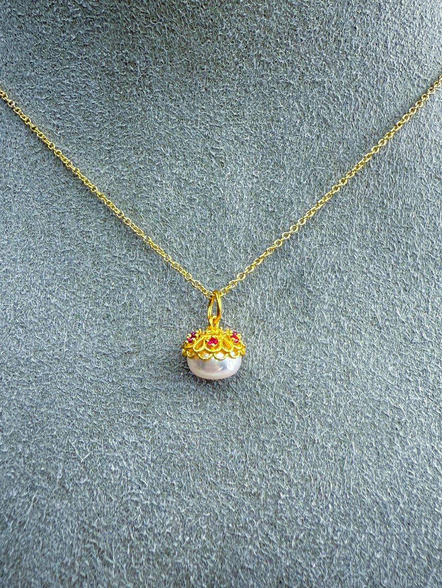 White Freshwater Pearl Necklace with Floral beadcap accented with pink CZ stones. 