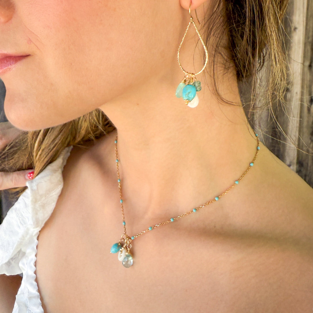Turquoise, blue gemstone & shell charms on a beaded enamel vermeil chain with matching hammered teardrop hoop earrings.