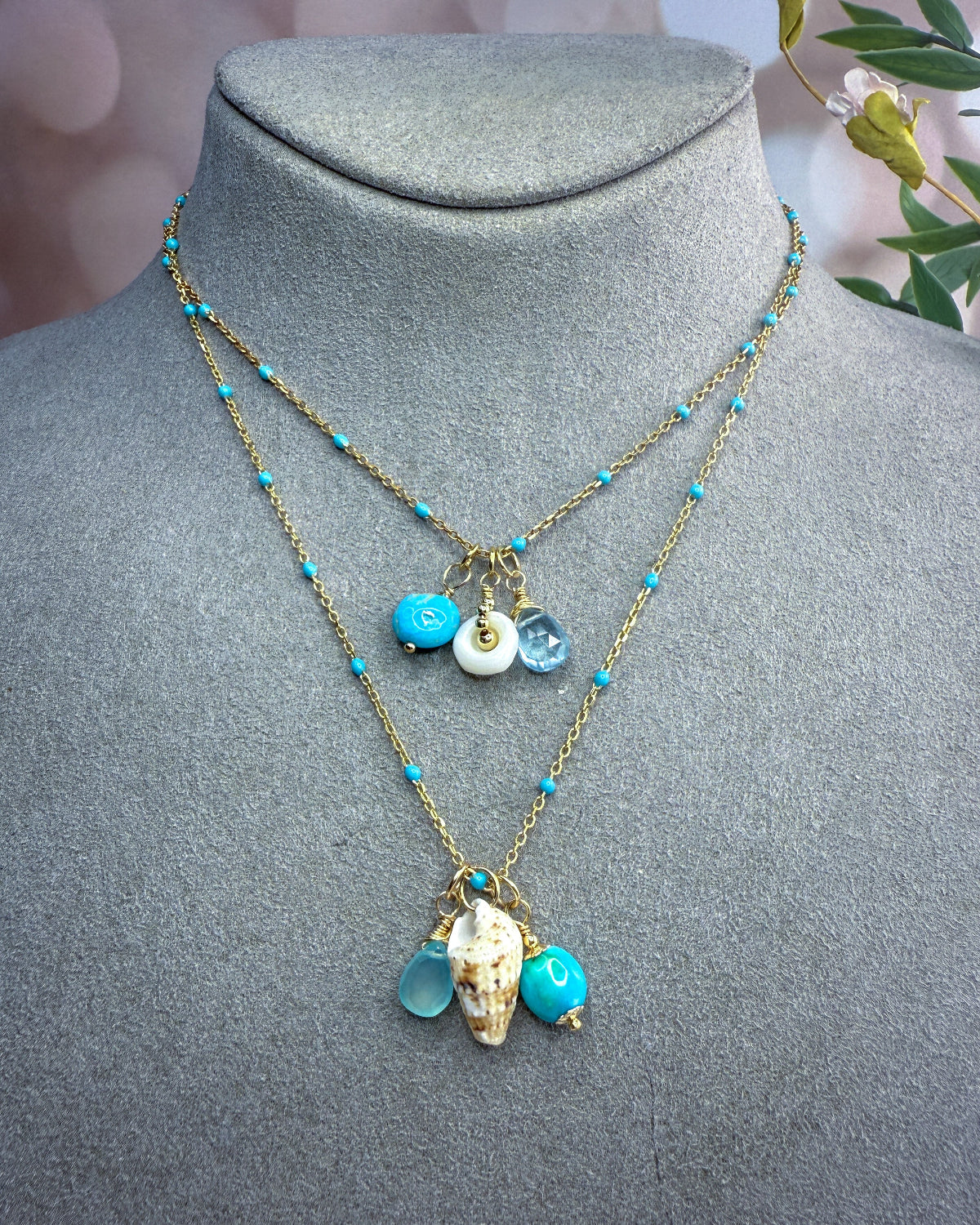 Turquoise, blue gemstone & shell charms on a beaded enamel vermeil chain.